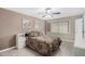 Bright bedroom with a double bed and ceiling fan at 10322 W Manzanita Dr, Sun City, AZ 85373