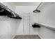 Well-organized closet with shoe and clothing storage at 10322 W Manzanita Dr, Sun City, AZ 85373