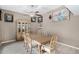 Bright dining room with wood table and chairs, hardwood-look floors at 10322 W Manzanita Dr, Sun City, AZ 85373