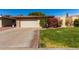 Ranch style home with attached garage and landscaped yard at 10322 W Manzanita Dr, Sun City, AZ 85373