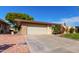 Single story home with attached garage and manicured lawn at 10322 W Manzanita Dr, Sun City, AZ 85373
