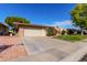 Front view of a single story home with a spacious driveway at 10322 W Manzanita Dr, Sun City, AZ 85373