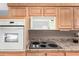 Well-equipped kitchen with built-in microwave and electric cooktop at 10322 W Manzanita Dr, Sun City, AZ 85373