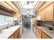 Bright kitchen with light wood cabinets and tile flooring at 10322 W Manzanita Dr, Sun City, AZ 85373