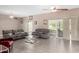 Spacious living room with leather couches and large windows at 10322 W Manzanita Dr, Sun City, AZ 85373