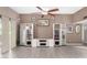 Living room featuring built-in shelving and hardwood-look floors at 10322 W Manzanita Dr, Sun City, AZ 85373
