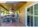 Covered patio with dining area and sliding glass doors at 10322 W Manzanita Dr, Sun City, AZ 85373