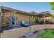 Spacious covered patio, perfect for outdoor entertaining, with seating area and ceiling fan at 10322 W Manzanita Dr, Sun City, AZ 85373