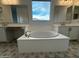 Elegant bathroom with soaking tub, double vanity, and designer tile at 11462 E Utopia Ave, Mesa, AZ 85212