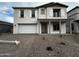 Two-story house with neutral color scheme and a two-car garage at 11462 E Utopia Ave, Mesa, AZ 85212