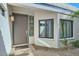 Modern front door with window accents and a walkway at 11699 N 80Th Pl, Scottsdale, AZ 85260