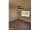 Bright bedroom featuring wood-look floors and a ceiling fan at 12432 W Fieldstone Dr, Sun City West, AZ 85375