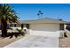 Front view of a ranch style home with a two-car garage at 12432 W Fieldstone Dr, Sun City West, AZ 85375