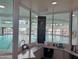 View of the community's indoor swimming pool from the reception area at 12432 W Fieldstone Dr, Sun City West, AZ 85375