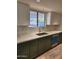Modern kitchen featuring updated cabinets, quartz countertops, and stainless steel appliances at 12432 W Fieldstone Dr, Sun City West, AZ 85375