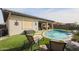 Beautiful kidney-shaped pool surrounded by lush grass at 15834 S 177Th Ave, Goodyear, AZ 85338