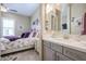 Bright bathroom with a single vanity and view into bedroom at 15834 S 177Th Ave, Goodyear, AZ 85338