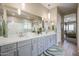 Spa-like bathroom with double sinks, a large shower, and plenty of counter space at 15834 S 177Th Ave, Goodyear, AZ 85338