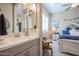 Modern bathroom with a double vanity and a view into a bedroom at 15834 S 177Th Ave, Goodyear, AZ 85338
