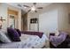 Bedroom with a queen bed, purple accents and sliding door closet at 15834 S 177Th Ave, Goodyear, AZ 85338
