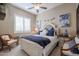 Charming bedroom with a queen-size bed and stylish decor at 15834 S 177Th Ave, Goodyear, AZ 85338