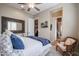 Spacious bedroom with a queen-size bed and access to a bathroom at 15834 S 177Th Ave, Goodyear, AZ 85338