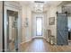 Bright and airy entryway with wood-look floors and barn door at 15834 S 177Th Ave, Goodyear, AZ 85338