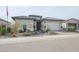 Single story home with a two car garage and desert landscaping at 15834 S 177Th Ave, Goodyear, AZ 85338