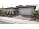 Single story home with a two car garage and desert landscaping at 15834 S 177Th Ave, Goodyear, AZ 85338