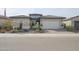 Single story home with a two car garage and desert landscaping at 15834 S 177Th Ave, Goodyear, AZ 85338