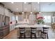 Modern kitchen with white cabinets, a large island, and stainless steel appliances at 15834 S 177Th Ave, Goodyear, AZ 85338