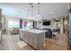 Open concept kitchen with island and view into living room at 15834 S 177Th Ave, Goodyear, AZ 85338