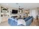 Living room with sectional sofa, fireplace, and built-in shelving at 15834 S 177Th Ave, Goodyear, AZ 85338