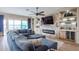 Living room with sectional sofa, fireplace, and built-in shelving at 15834 S 177Th Ave, Goodyear, AZ 85338