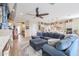 Spacious living room featuring a comfortable sectional sofa and a fireplace at 15834 S 177Th Ave, Goodyear, AZ 85338
