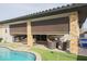 Covered patio with retractable shades and wicker furniture at 15834 S 177Th Ave, Goodyear, AZ 85338
