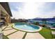 Stunning kidney shaped pool with a putting green at 15834 S 177Th Ave, Goodyear, AZ 85338