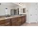 Bathroom with double vanity, granite countertops, and large mirror at 1623 E Hidalgo St, Apache Junction, AZ 85119