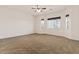 Large bedroom with wall-to-wall carpeting and ceiling fan at 1623 E Hidalgo St, Apache Junction, AZ 85119