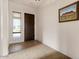 Inviting entryway featuring a dark wood door and tiled floor at 1623 E Hidalgo St, Apache Junction, AZ 85119