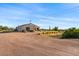 Desert landscape with a single story home and garage at 1623 E Hidalgo St, Apache Junction, AZ 85119
