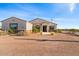 Single-story home with stone accents and desert landscaping at 1623 E Hidalgo St, Apache Junction, AZ 85119