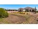 Single-story home with stone accents and desert landscaping at 1623 E Hidalgo St, Apache Junction, AZ 85119