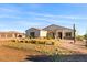 Single-story home with stone accents and desert landscaping at 1623 E Hidalgo St, Apache Junction, AZ 85119