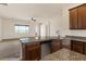 Island kitchen with stainless steel appliances at 1623 E Hidalgo St, Apache Junction, AZ 85119