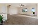 Spacious living room with large windows and carpeted floors at 1623 E Hidalgo St, Apache Junction, AZ 85119