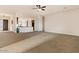 Open living room with kitchen views and neutral colors at 1623 E Hidalgo St, Apache Junction, AZ 85119