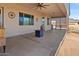 Covered patio with ceiling fan, fire pit, and latticework for privacy at 1623 E Hidalgo St, Apache Junction, AZ 85119