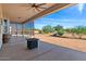 Covered patio with fire pit and backyard views at 1623 E Hidalgo St, Apache Junction, AZ 85119