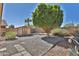 Landscaped backyard with a storage shed and gravel at 17124 N Melissa Ln, Surprise, AZ 85374